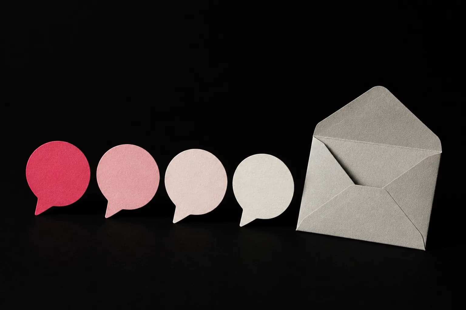 A solid paper speech bubble beside three increasingly pale bubbles.