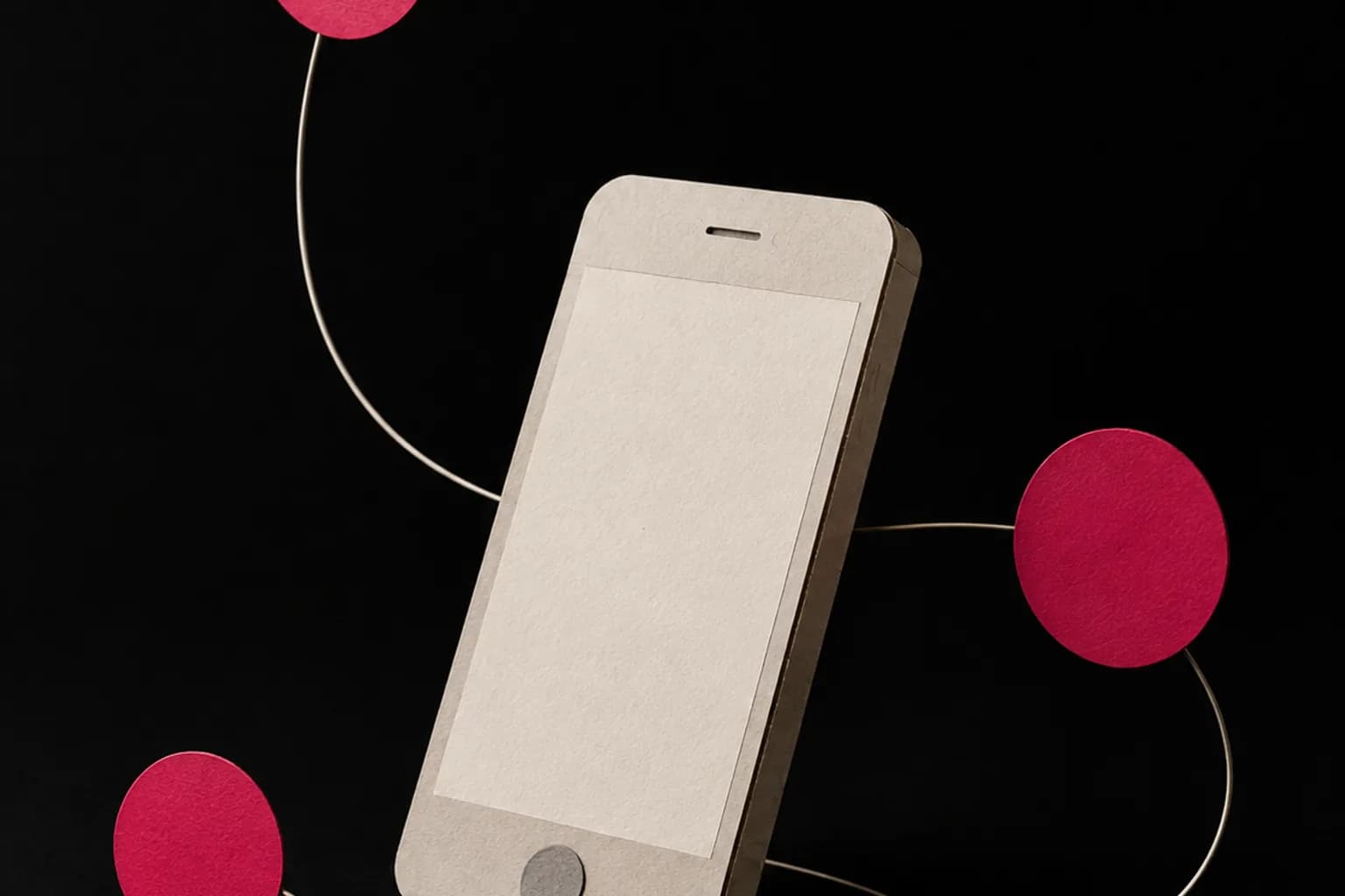 Three small paper circles arranged around a folded cardboard phone.
